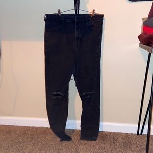 Ripped black American Eagle jeans.